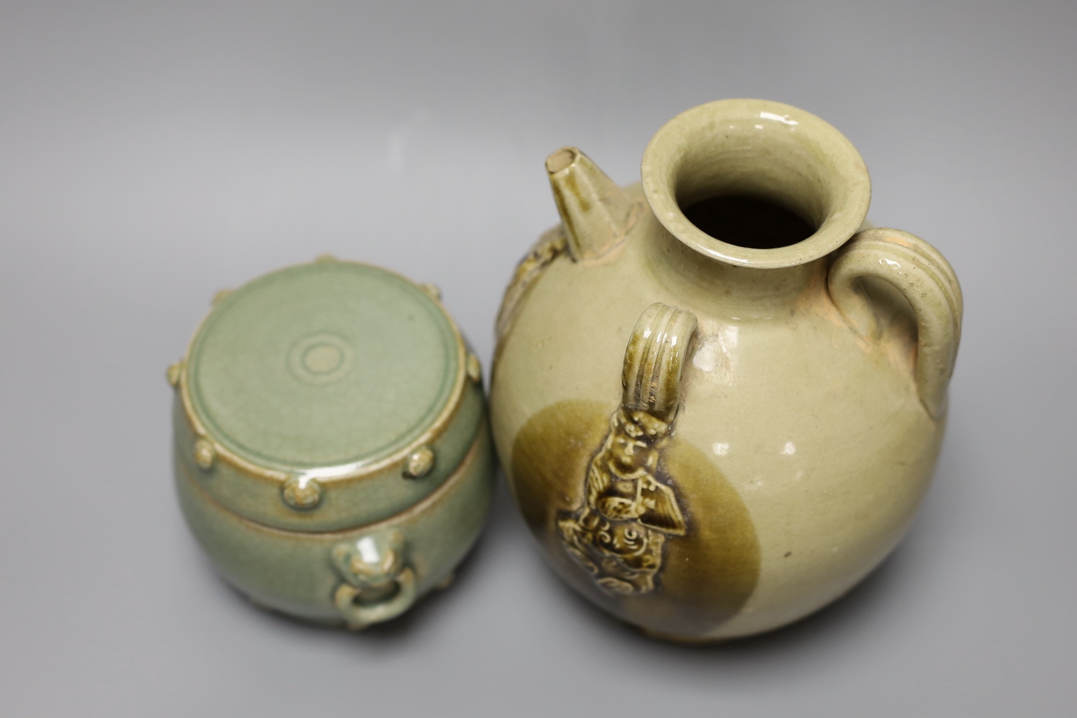 A Chinese buff-glazed wine pot and celadon jar and cover, 18.5cm